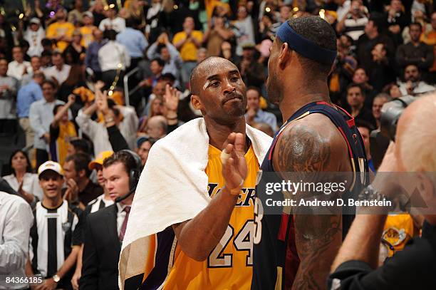 Kobe Bryant of the Los Angeles Lakers pats the chest of LeBron James of the Cleveland Cavaliers following their game at Staples Center on January 19,...