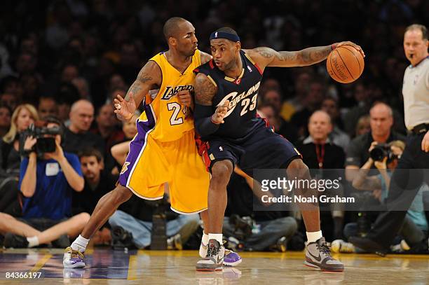 LeBron James of the Cleveland Cavaliers posts up against Kobe Bryant of the Los Angeles Lakers at Staples Center on January 19, 2009 in Los Angeles,...
