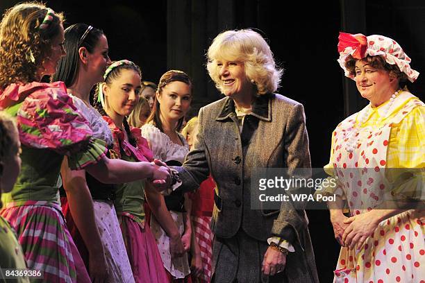 Camilla, Duchess of Cornwall speaks with young members from the Dorothy Coleborn School of Dance, who also appear in the pantomime Jack and the...
