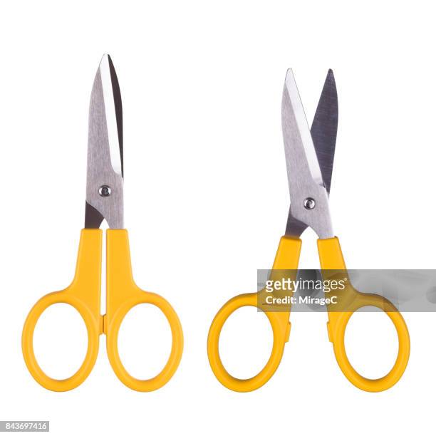 yellow colored open and close scissors - tijeras fotografías e imágenes de stock