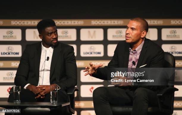 Kolo Toure and Stan Collymore talk during day 3 of the Soccerex Global Convention at Manchester Central Convention Complex on September 6, 2017 in...