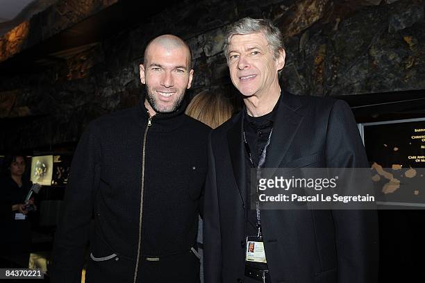 Former footballer Zinedine Zidane and Arsenal manager Arsene Wenger visit the IWC Schaffhausen Party during the Salon International de la Haute...