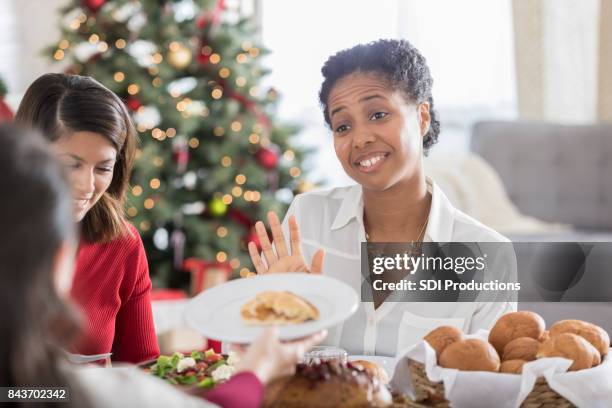 christmas dinner guest declines dessert - christmas mince pies stock pictures, royalty-free photos & images