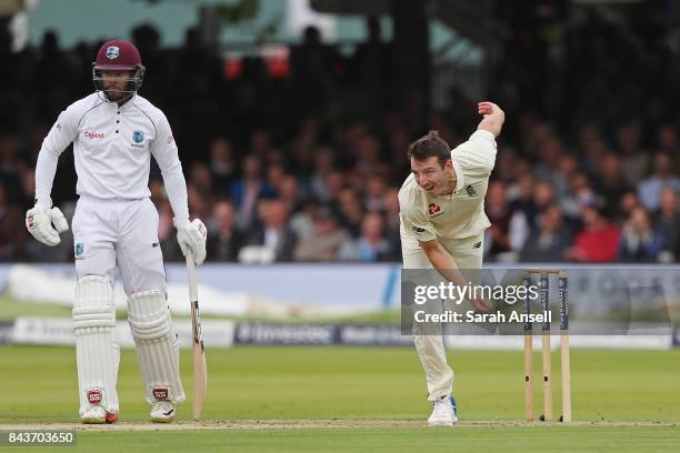 Toby Roland-Jones of England bowls as Shai Hope of West Indies looks on during day one of the 1st Investec Test match between England and West Indies...