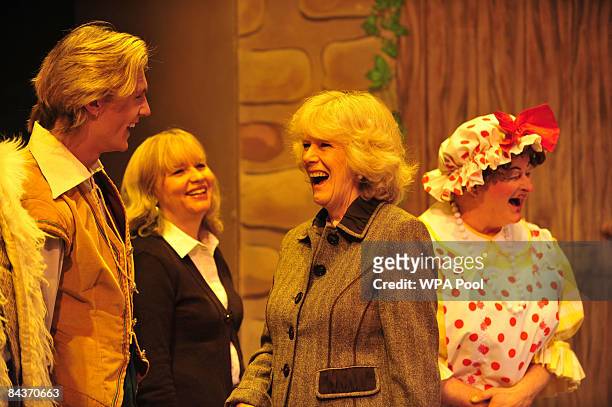 Camilla, Duchess of Cornwall speaks with Lewis Bradley, the runner-up of the BBC's Any Dream Will Do competition and cast member of the pantomime...