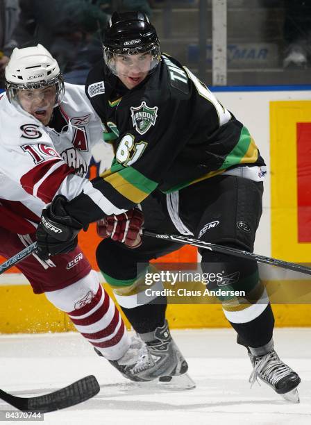 John Tavares of the London Knights battles for possesion of the puck with Tim Priamo of the Guelph Storm in a game on January 16, 2009 at the John...