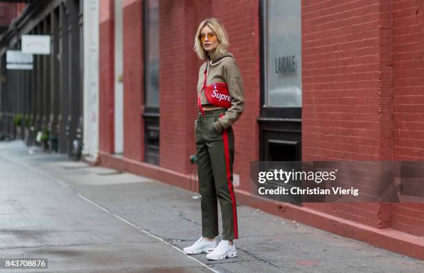 Lisa Hahnbueck wearing red Supreme x Louis Vuitton bag, khaki hoody,  News Photo - Getty Images