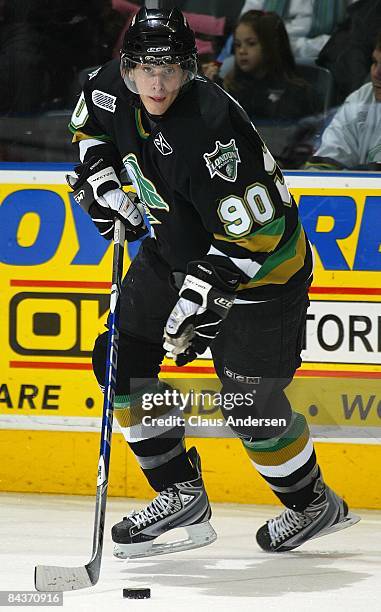 Philip McRae of the London Knights turns with the puck in a game against the Guelph Storm on January 16, 2009 at the John Labatt Centre in London,...