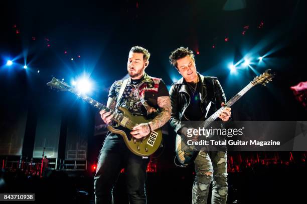 Guitarists Synyster Gates and Zacky Vengeance of American hard rock group Avenged Sevenfold, photographed during a live performance at the O2 Arena...