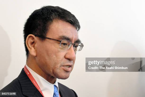 Japanese Foreign Minister Taro Kono speaks to media reporters after his meeting with South Korean Foreign Minister Kang Kyung-wha on September 7,...