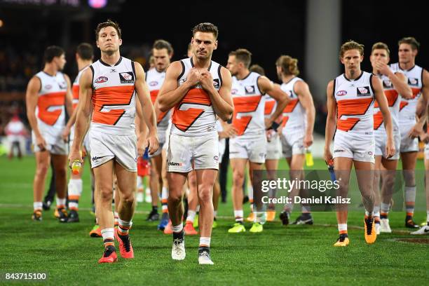 Toby Greene of the Giants walk from the ground looking dejected after being defeated by the Adelaide Crows during the AFL First Qualifying Final...