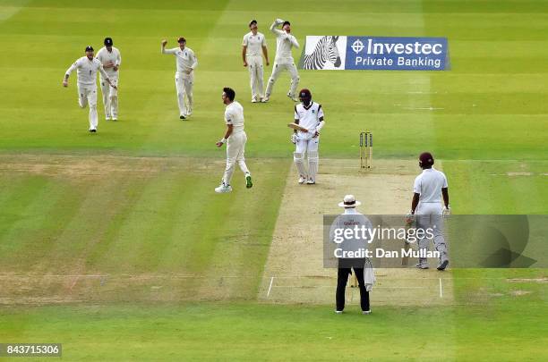 James Anderson of England celebrates taking the wicket of Kraigg Braithwaite of the West Indies during day one of the 3rd Investec Test Match between...