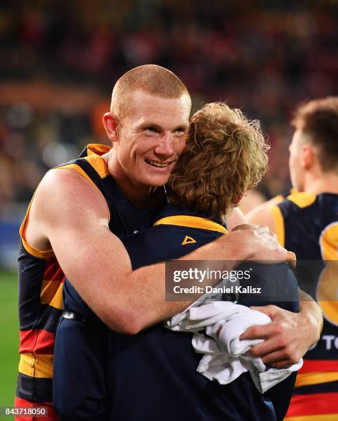 Sam Jacobs of the Crows and Rory Sloane of the Crows embrace after the AFL First Qualifying Final match between the Adelaide Crows and the Greater...
