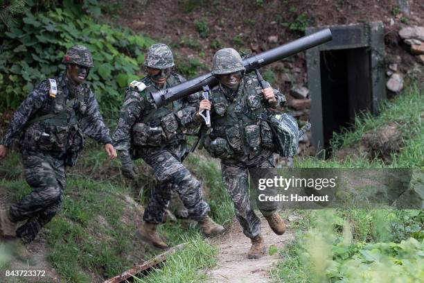 In this handout photo released by the South Korean Defense Ministry, South Korean marines participate in an exercise on September 6, 2017 in...