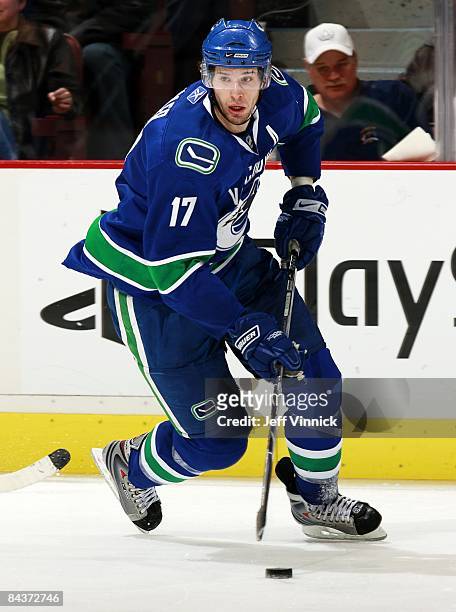 Ryan Kesler of the Vancouver Canucks skates up ice with the puck during the game against the Philadelphia Flyers at General Motors Place on December...