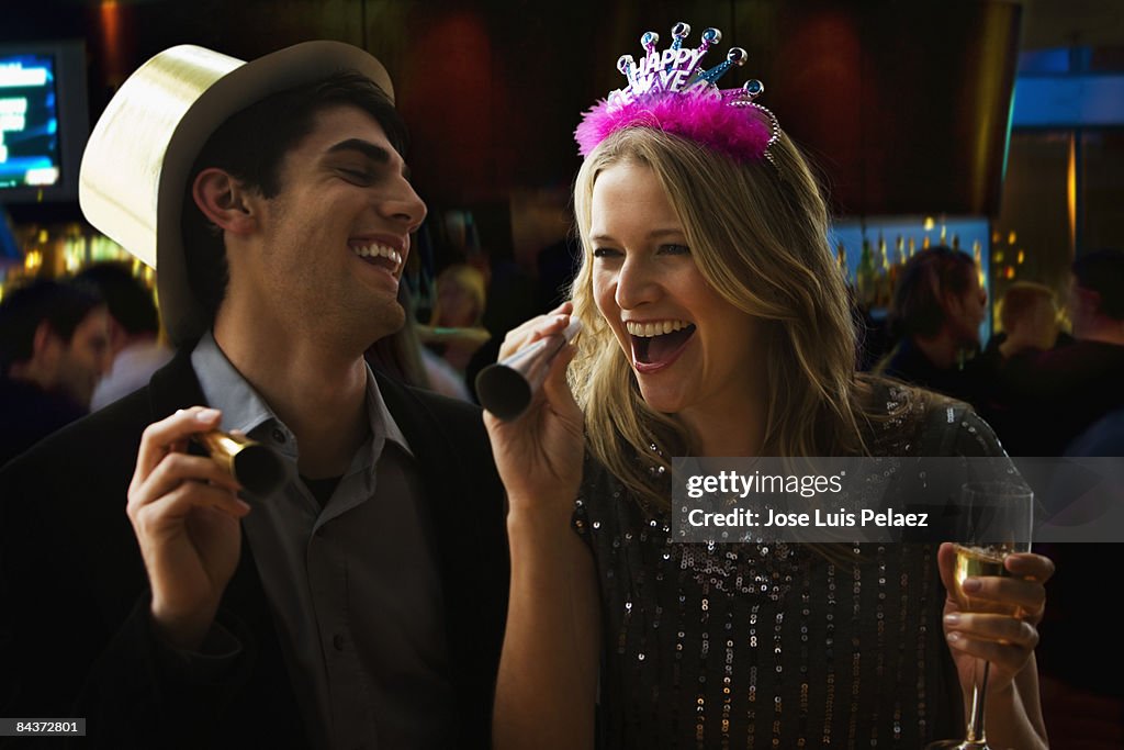 Young couple celebrating New Year 