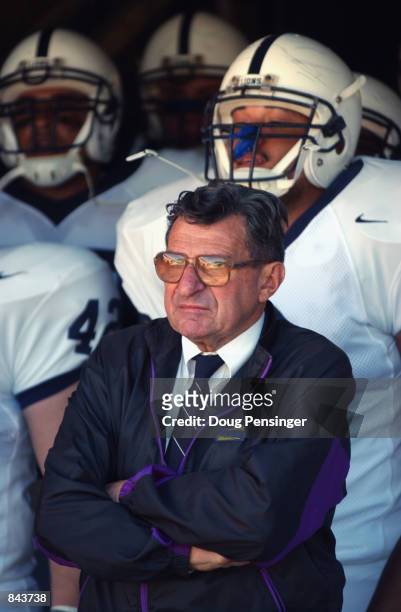 Head coach Joe Paterno of the Penn State Nittany Lions stands in front of his players before the NCAA football game against the Virginia Cavaliers on...