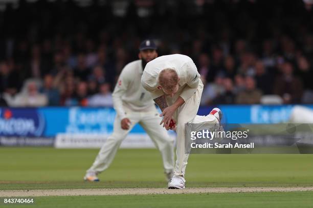 Ben Stokes of England takes a catch off his own bowling to dismiss Kieran Powell of West Indies during day one of the 1st Investec Test match between...