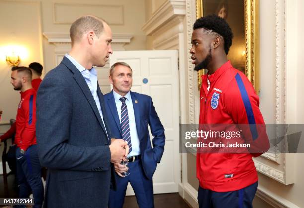Prince William, Duke of Cambridge President of the Football Association, speaks with England U20 manager Paul Simpson and Josh Onomah during a...