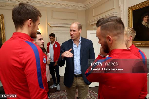 Prince William, Duke of Cambridge, President of the Football Association, speaks with players as he hosts a reception for the Under-20 England...