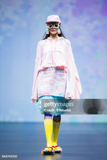 Model showcases designs by POURQUOI on the runway during the Designers' Collection Show 2 - MACAO FASHION PARADE on the Day 2 of the CentreStage Hong...