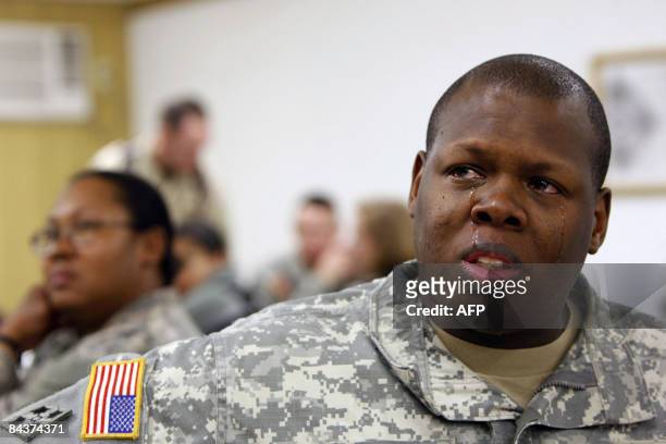 Soldier cries as he watches the live televised inauguration ceremony for US President Barack Obama on January 20, 2009 in Baghdad's fortified Green...