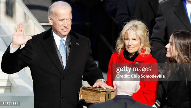 Vice President-elect Joseph R. Biden is sworn in by Supreme Court Justice John Paul Stevens during the inauguration of Barack Obama as the 44th...