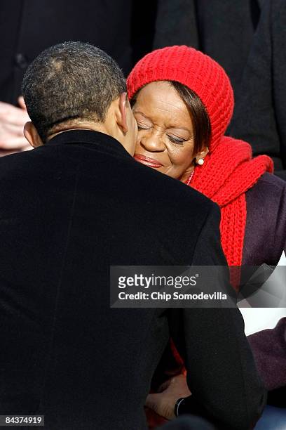 President Barack Obama kisses his mother-in-law during his inauguration as the 44th President of the United States of America on the West Front of...