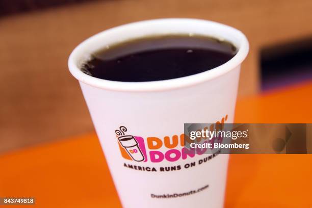 Cup of coffee is arranged for a photograph at a Dunkin' Donuts Inc. Location in Los Angeles, California, U.S., on Wednesday, Sept. 6, 2017. Dunkin'...