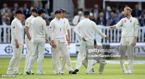 Ben Stokes of England celebrates with teammates after dismissing Roston Chase of the West Indies during day one of the 3rd Investec Test match...