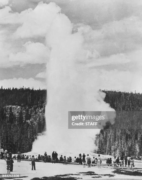 Undated picture of tourists visiting the Old Faithfull geyser of Yellowstone national park in Wyoming.