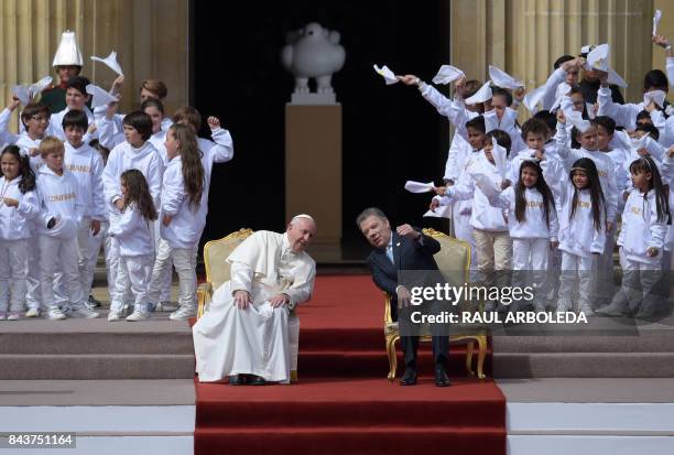 Pope Francis and Colombian President Juan Manuel Santos talk during a meeting at the Nariño presidential palace in Bogota on September 7, 2017. Pope...