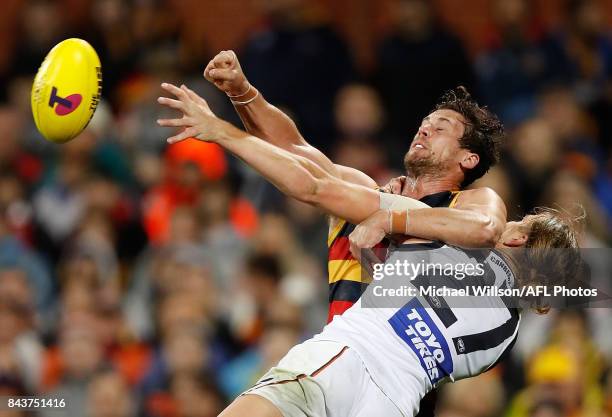 Harrison Himmelberg of the Giants and Kyle Hartigan of the Crows compete for the ball during the AFL First Qualifying Final match between the...