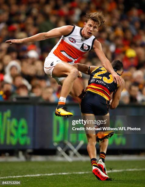 Lachie Whitfield of the Giants and Charlie Cameron of the Crows in action during the AFL First Qualifying Final match between the Adelaide Crows and...