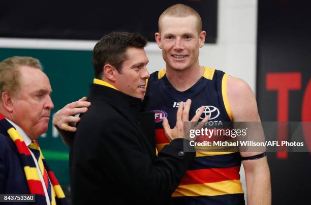 Sam Jacobs of the Crows and CEO Andrew Fagan embrace during the AFL First Qualifying Final match between the Adelaide Crows and the Greater Western...