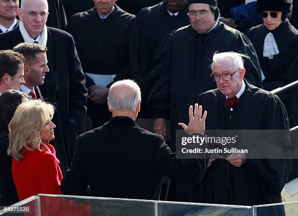 Vice President-elect Joseph R. Biden is sworn in by Supreme Court Justice John Paul Stevens during the inauguration of Barack Obama as the 44th...