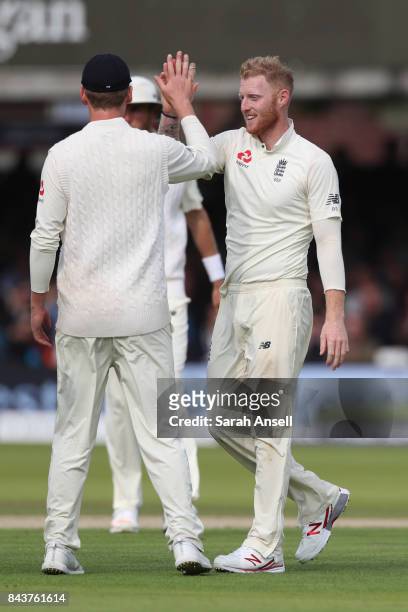 Ben Stokes of England celebrates with teammates after taking the wicket of Roston Chase of West Indies during day one of the 1st Investec Test match...