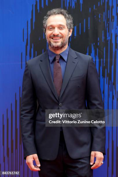 Claudio Santamaria walks the red carpet ahead of the 'Brutti E Cattivi' screening during the 74th Venice Film Festival at Sala Darsena on September...