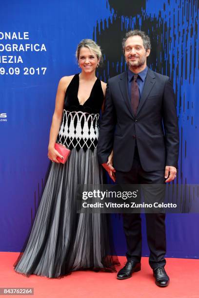 Francesca Barra and Claudio Santamaria walk the red carpet ahead of the 'Brutti E Cattivi' screening during the 74th Venice Film Festival at Sala...