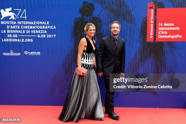 Francesca Barra and Claudio Santamaria walk the red carpet ahead of the 'Brutti E Cattivi' screening during the 74th Venice Film Festival at Sala...