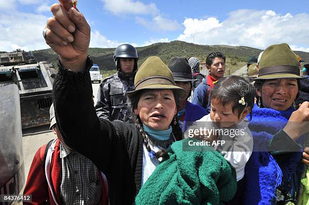An indigenous woman shouts slogans during a protest in the Cuenca-Loja highway, 450 km south of Quito, on January 20 against President Rafael...