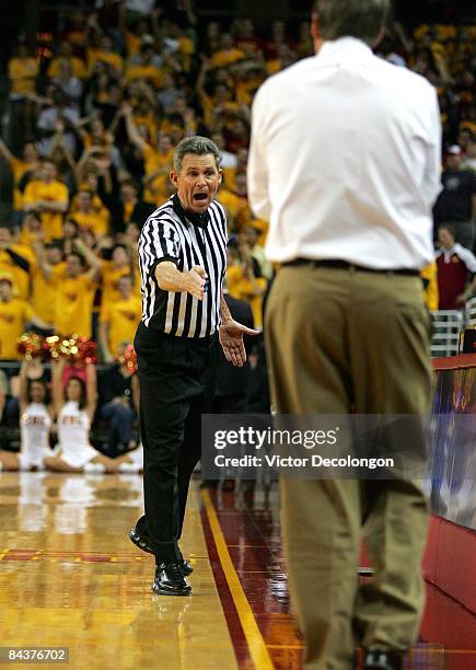 Referee Mark Reischling tells head coach Tim Flod to stay behind the line during the game between Arizona State and USC at Galen Center on January...