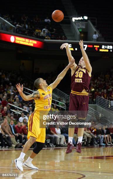 Rihards Kuksiks of Arizona State shoots the outside jump shot against Daniel Hackett of USC during first half of the game at Galen Center on January...