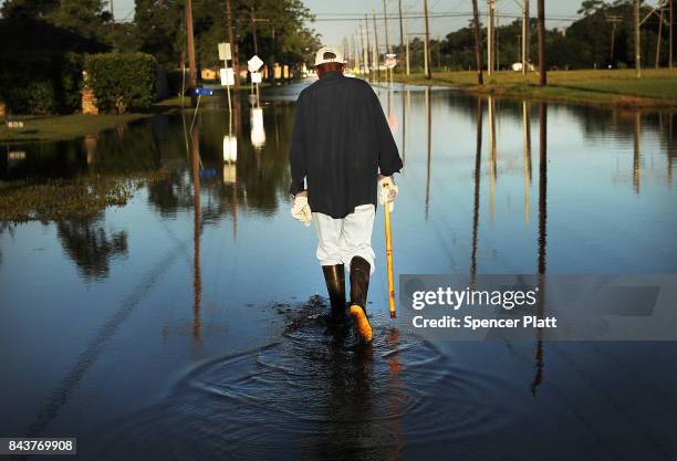 Paul Morris checks on neighbors homes in a flooded district of Orange as Texas slowly moves toward recovery from the devastation of Hurricane Harvey...