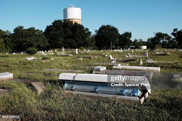 Casket, uprooted by the floods, sits in a cemetery in Orange as Texas slowly moves toward recovery from the devastation of Hurricane Harvey on...