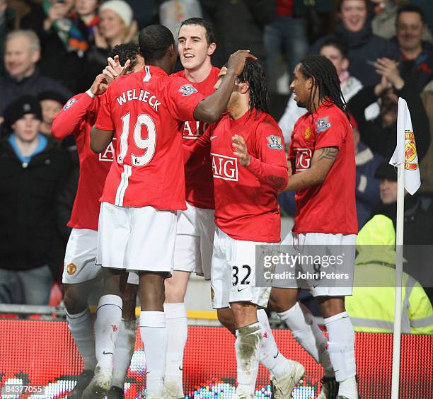 John O'Shea of Manchester United celebrates scoring their second goal during the Carling Cup Semi-Final 2nd Leg match between Manchester United and...