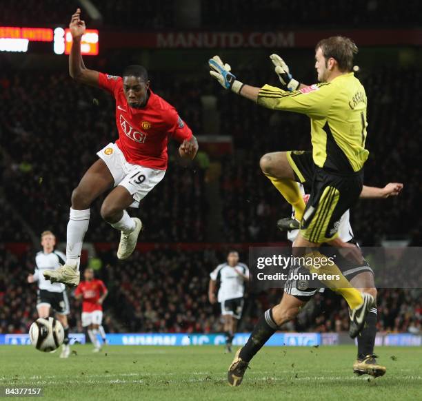 Danny Welbeck of Manchester United clashes with Roy Carroll of Derby County during the Carling Cup Semi-Final 2nd Leg match between Manchester United...