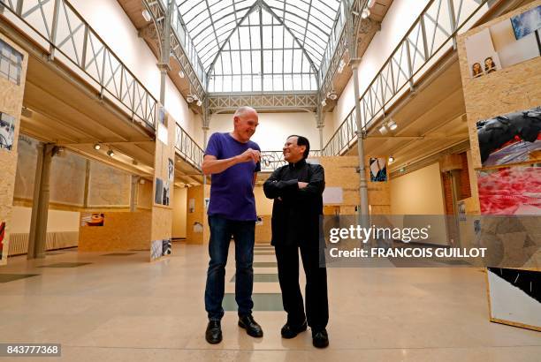 Britain's artist Richard Wentworth and Franco-Tunisian fashion designer Azzedine Alaia pose during an exposition of Wentworth's photographic work on...