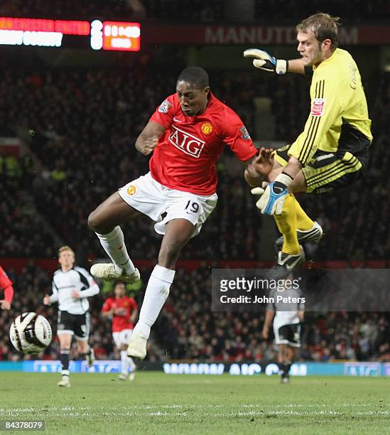 Danny Welbeck of Manchester United clashes with Roy Carroll of Derby County during the Carling Cup Semi-Final 2nd Leg match between Manchester United...