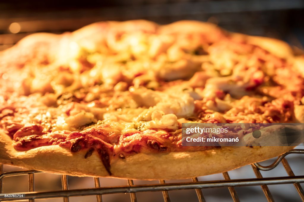 Close-Up Of Fresh Pizza with chicken Baking In Oven